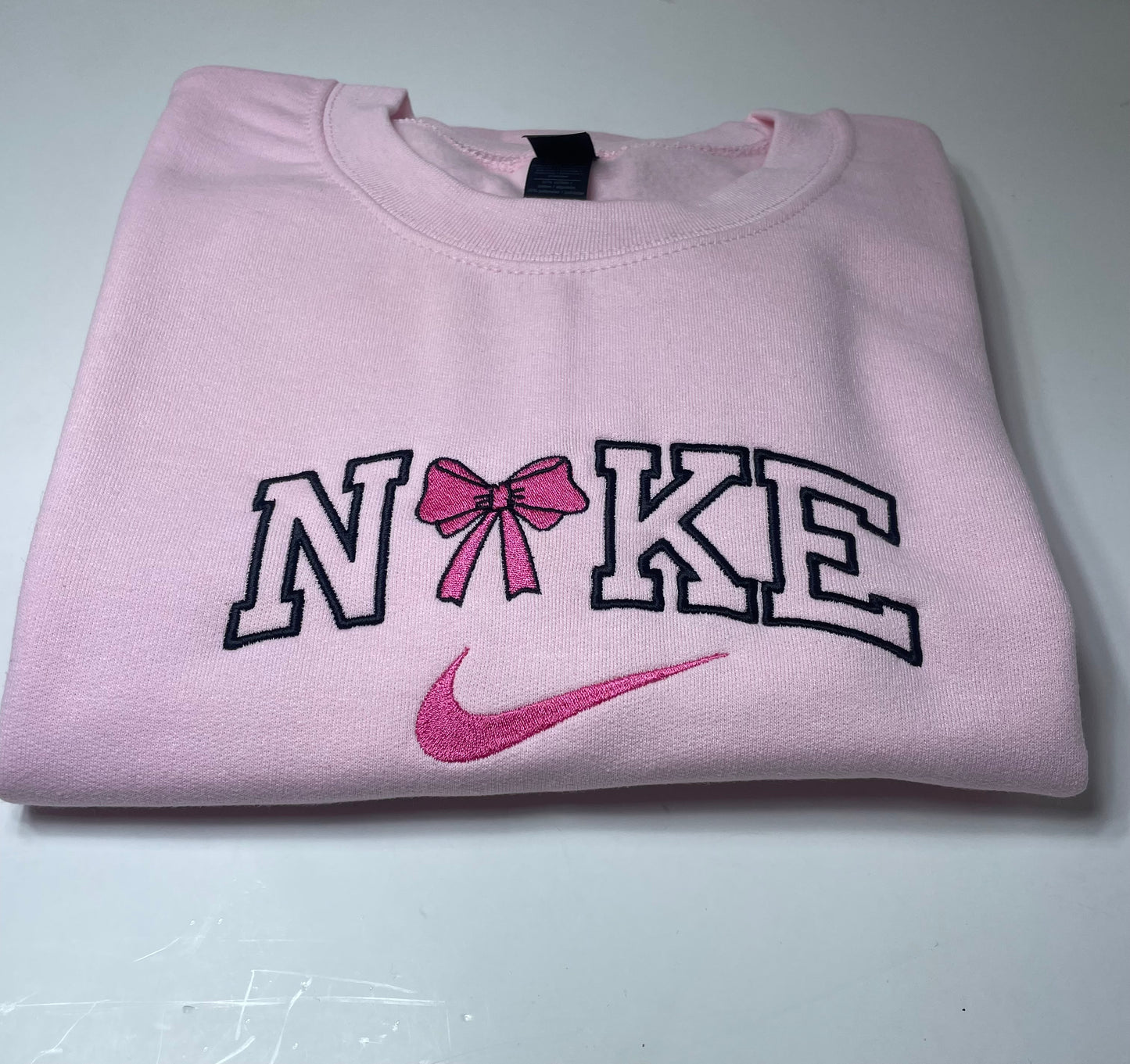 Long sleeve pink bow crewneck sweater